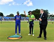 28 June 2022; Andrew Balbirnie of Ireland, centre, makes the toss watched by Hardik Pandya of India, left, and match referee Kevin Gallagher before the LevelUp11 Second Men's T20 International match between Ireland and India at Malahide Cricket Club in Dublin. Photo by Sam Barnes/Sportsfile