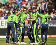 28 June 2022; Ireland players including Mark Adair, centre, celebratre the wicket of Ishan Kishan of India during the LevelUp11 Second Men's T20 International match between Ireland and India at Malahide Cricket Club in Dublin. Photo by Sam Barnes/Sportsfile