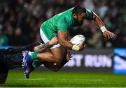 29 June 2022; Bundee Aki of Ireland is tackled by Connor Garden-Bachop of Maori All Blacks, on the way to scoring his side's first try, during the match between the Maori All Blacks and Ireland at the FMG Stadium in Hamilton, New Zealand. Photo by Brendan Moran/Sportsfile