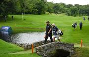 30 June 2022; Shane Lowry of Ireland, left, and caddie Brian Martin walk on to the 13th green during day one of the Horizon Irish Open Golf Championship at Mount Juliet Golf Club in Thomastown, Kilkenny. Photo by Eóin Noonan/Sportsfile