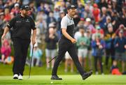 30 June 2022; Seamus Power of Ireland, right, reacts after a birdie putt on the ninth green as Shane Lowry of Ireland, left, looks on during day one of the Horizon Irish Open Golf Championship at Mount Juliet Golf Club in Thomastown, Kilkenny. Photo by Eóin Noonan/Sportsfile