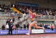 26 June 2022; Kelly McGrory of Tír Chonaill AC, Donegal, crosses the line to win the women's 400m hurdles  during day two of the Irish Life Health National Senior Track and Field Championships 2022 at Morton Stadium in Dublin. Photo by Sam Barnes/Sportsfile