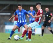 1 July 2022; Luke Desmond of Cobh Ramblers in action against Martin Coughlan of Treaty United during the SSE Airtricity League First Division match between Cobh Ramblers and Treaty United at St Colman's Park in Cobh, Cork. Photo by Michael P Ryan/Sportsfile