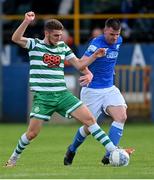 1 July 2022; Dylan Watts of Shamrock Rovers is tackled by Conor Tourish of Finn Harps during the SSE Airtricity League Premier Division match between Finn Harps and Shamrock Rovers at Finn Park in Ballybofey, Donegal. Photo by Ramsey Cardy/Sportsfile