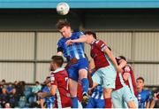 1 July 2022; Jack Lynch of Treaty United in action against Cobh Ramblers players John Kavanagh, right, and Danny O'Connell during the SSE Airtricity League First Division match between Cobh Ramblers and Treaty United at St Colman's Park in Cobh, Cork. Photo by Michael P Ryan/Sportsfile