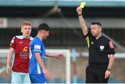 1 July 2022; Martin Coughlan of Treaty United is shown a yellow card by referee Declan Toland during the SSE Airtricity League First Division match between Cobh Ramblers and Treaty United at St Colman's Park in Cobh, Cork. Photo by Michael P Ryan/Sportsfile