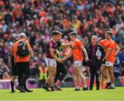 26 June 2022;The two captains, Seán Kelly of Galway and Aidan Nugent of Armagh, centre, shake hands after they both had been issued with red cards before the start of extra time after a melee as the teams went to the dressing rooms at full time at the GAA Football All-Ireland Senior Championship Quarter-Final match between Armagh and Galway at Croke Park, Dublin. Photo by Ray McManus/Sportsfile