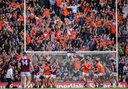 26 June 2022; Armagh supporters celebrate as Rian O'Neill's late free goes over the bar to leave the score level in normal time during the GAA Football All-Ireland Senior Championship Quarter-Final match between Armagh and Galway at Croke Park, Dublin. Photo by Ray McManus/Sportsfile