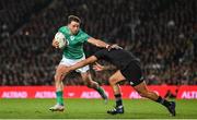 2 July 2022; Hugo Keenan of Ireland is tackled by Leicester Fainga'anuku of New Zealand during the Steinlager Series match between the New Zealand and Ireland at Eden Park in Auckland, New Zealand. Photo by Brendan Moran/Sportsfile