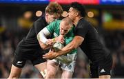 2 July 2022; Keith Earls of Ireland is tackled by Jordie Barrett, left, and Leicester Fainga'anuku of New Zealand during the Steinlager Series match between the New Zealand and Ireland at Eden Park in Auckland, New Zealand. Photo by Brendan Moran/Sportsfile