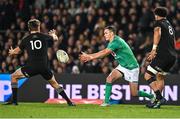 2 July 2022; Jonathan Sexton of Ireland offloads under pressure from Beauden Barrett of New Zealand during the Steinlager Series match between the New Zealand and Ireland at Eden Park in Auckland, New Zealand. Photo by Brendan Moran/Sportsfile
