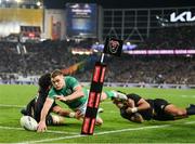 2 July 2022; Garry Ringrose of Ireland scores his side's second try despite the tackle of Ardie Savea of New Zealand during the Steinlager Series match between the New Zealand and Ireland at Eden Park in Auckland, New Zealand. Photo by Brendan Moran/Sportsfile