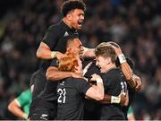 2 July 2022; Pita Gus Sowakula of New Zealand, obscured, celebrates with teammates including Ardie Savea, top, after scoring his side's sixth try during the Steinlager Series match between the New Zealand and Ireland at Eden Park in Auckland, New Zealand. Photo by Brendan Moran/Sportsfile