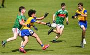 2 July 2022; Joseph McDonagh of San Francisco is tackled by Thomas Skehan of Rathgormack during the match between Rathgormack, Waterford, and San Francisco at the John West Féile Peile na nÓg National Gaelic and Ladies football finals 2022 at the GAA National Games Development Centre Campus in Abbotstown, Dublin. Eighty-eight club sides from Ireland, the UK, Europe and US competed in the final stages of the under-15 competition across nine venues, one of the biggest underage sporting events on the continent, sponsored for the seventh time by John West. Photo by Ramsey Cardy/Sportsfile