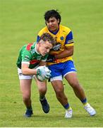 2 July 2022; Thomas Lynch of Rathgormack is tackled by Christian Calero of San Francisco during the match between Rathgormack, Waterford, and San Francisco John West Féile Peile na nÓg National Gaelic and Ladies football finals 2022 at the GAA National Games Development Centre Campus in Abbotstown, Dublin. Eighty-eight club sides from Ireland, the UK, Europe and US competed in the final stages of the under-15 competition across nine venues, one of the biggest underage sporting events on the continent, sponsored for the seventh time by John West. Photo by Ramsey Cardy/Sportsfile