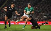 2 July 2022; Hugo Keenan of Ireland is tackled by Leicester Fainga'anuku of New Zealand during the Steinlager Series match between the New Zealand and Ireland at Eden Park in Auckland, New Zealand. Photo by Brendan Moran/Sportsfile