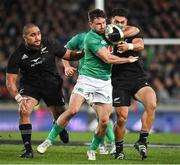 2 July 2022; Hugo Keenan of Ireland is tackled by Quinn Tupaea of New Zealand during the Steinlager Series match between the New Zealand and Ireland at Eden Park in Auckland, New Zealand. Photo by Brendan Moran/Sportsfile