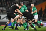 2 July 2022; Andrew Porter of Ireland is tackled by Brodie Retallick and Sam Cane of New Zealand during the Steinlager Series match between the New Zealand and Ireland at Eden Park in Auckland, New Zealand. Photo by Brendan Moran/Sportsfile