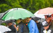 2 July 2022; Spectators during a rain shower during day three of the Horizon Irish Open Golf Championship at Mount Juliet Golf Club in Thomastown, Kilkenny. Photo by Eóin Noonan/Sportsfile