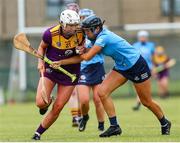 2 July 2022; Jackie Quigley of Wexford in action against Emma O'Byrne of Dublin during round 5 of the Glen Dimplex All-Ireland Senior Camogie Championship match between Wexford and Dublin at Bellefield GAA Complex in Enniscorthy, Wexford. Photo by Michael P Ryan/Sportsfile