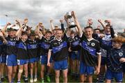 2 July 2022; Joint captains of St Patrick's Dromintee Co Armagh Fergus Toale, left, and Keane McArdle lift the cup after the Cup Final match between St Patrick's Dromintee Co Armagh and Durlas Og Co Tipperary at the John West National Football Feile 2022 event at Kildare GAA Centre in Hawkfield, Kildare. Photo by Matt Browne/Sportsfile