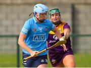 2 July 2022; Eve O'Brien of Dublin in action against /Joanne Dillon of Wexford during round 5 of the Glen Dimplex All-Ireland Senior Camogie Championship at Bellefield GAA Complex in Enniscorthy, Wexford. Photo by Michael P Ryan/Sportsfile