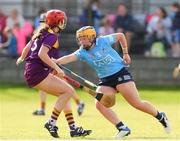 2 July 2022; Elyse-Jamieson Murphy of Dublin in action against Anais Curran of Wexford during round 5 of the Glen Dimplex All-Ireland Senior Camogie Championship at Bellefield GAA Complex in Enniscorthy, Wexford. Photo by Michael P Ryan/Sportsfile