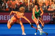 2 July 2022; Hannah McLoughlin of Ireland is tackled by Maria Verschoor of The Netherlands during the FIH Women's Hockey World Cup Pool A match between Netherlands and Ireland at Wagener Stadium in Amstelveen, Netherlands. Photo by Jeroen Meuwsen/Sportsfile