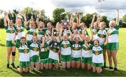 2 July 2022; Aoife Morris captain of Portlaois Co Laois lifts the shield as her team-mates celebrate after the Shield Final between Portlaois Co Laois and Blessington Co Wicklow at the John West National Football Feile 2022 event at Kildare GAA Centre in Hawkfield, Kildare. Photo by Matt Browne/Sportsfile