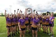 2 July 2022; Carryduff Co Down captains Ellie Sergeant, left, and Eimear Napier lift the cup as their team-mates celebrate after the Cup Final between Carryduff Co Down and Mullahahoran Co Cavan at the John West National Football Feile 2022 event at Kildare GAA Centre in Hawkfield, Kildare. Photo by Matt Browne/Sportsfile