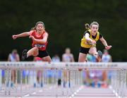 3 July 2022; Louise Mullins of Fanahan McSweeney A.C., left, and Ruby Cummins of Bandon A.C. competing in the Girl's U15 80m Hurdles during day one of the Irish Life Health National Juvenile Track and Field Championships at Tullamore in Offaly. Photo by George Tewkesbury/Sportsfile