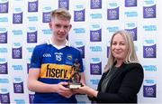 3 July 2022; Edel McCarthy from Electric Ireland presents Paddy McCormack of Tipperary with the Electric Ireland Best & Fairest Award after the GAA Hurling All-Ireland Minor Championship Final match between Tipperary and Offaly at UPMC Nowlan Park, Kilkenny. Photo by Matt Browne/Sportsfile