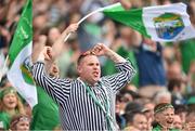 3 July 2022; A Limerick supporter celebrates a score during the GAA Hurling All-Ireland Senior Championship Semi-Final match between Limerick and Galway at Croke Park in Dublin. Photo by Stephen McCarthy/Sportsfile