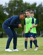 4 July 2022; Republic of Ireland international Rianna Jarrett with Noah Kenny during the INTERSPORT Elverys FAI Summer Soccer Schools at Curracloe United FC in Ballaghablake, Wexford. Photo by Piaras Ó Mídheach/Sportsfile