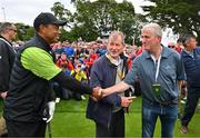 4 July 2022; Tiger Woods of USA, left, and Limerick hurling manager John Kiely shake hands alongside businessman JP McManus, centre, during day one of the JP McManus Pro-Am at Adare Manor Golf Club in Adare, Limerick. Photo by Eóin Noonan/Sportsfile