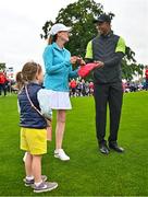 4 July 2022; Tiger Woods of USA signs an autograph for Ella Doe, daughter of Shelly McManus, during day one of the JP McManus Pro-Am at Adare Manor Golf Club in Adare, Limerick. Photo by Eóin Noonan/Sportsfile