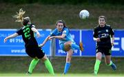 4 July 2022; Sadbh Doyle of Peamount United has a shot on goal despite pressure from Sophie Watters, left, and Sarah McKevitt of DLR Waves during the SSE Airtricity Women's National League match between DLR Waves and Peamount United at UCD Bowl in Belfield, Dublin. Photo by George Tewkesbury/Sportsfile