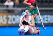 5 July 2022; Roisin Upton of Ireland receives medical treatment during the FIH Women's Hockey World Cup Pool A match between Ireland and Chile at Wagener Stadium in Amstelveen, Netherlands. Photo by Patrick Goosen/Sportsfile