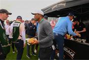 5 July 2022; Tiger Woods of USA gets a burger during day two of the JP McManus Pro-Am at Adare Manor Golf Club in Adare, Limerick. Photo by Ramsey Cardy/Sportsfile