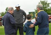 5 July 2022; Tiger Woods of USA with a grandson of JP McManus during day two of the JP McManus Pro-Am at Adare Manor Golf Club in Adare, Limerick. Photo by Ramsey Cardy/Sportsfile