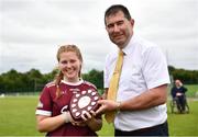 5 July 2022; Galway captain Martha McDermott accepts the shield from LGFA President Micheál Naughton during the LGFA National Under 17 Player Development Programme Festival Day at the GAA National Games Development Centre in Abbotstown, Dublin. Photo by David Fitzgerald/Sportsfile