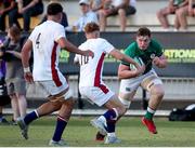 5 July 2022; Diarmuid Mangan of Ireland in action against Fin Smith of England during the Six Nations U20 summer series match between Ireland and England at Payanini Centre in Verona, Italy. Photo by Roberto Bregani/Sportsfile