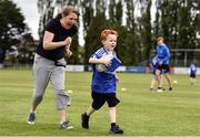 6 July 2022; Conor Liddy, aged 5, and his mother Nora in attendance during the 2022 Bank of Ireland Leinster Rugby Inclusion Camp at St Mary's College RFC in Dublin. Photo by Sam Barnes/Sportsfile