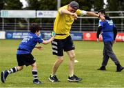 6 July 2022; Barra Thomas, aged 7, with coach Paul McGrath during the 2022 Bank of Ireland Leinster Rugby Inclusion Camp at St Mary's College RFC in Dublin. Photo by Sam Barnes/Sportsfile