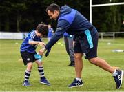 6 July 2022; Barra Thomas, aged 7, with coach Glenn Predy during the 2022 Bank of Ireland Leinster Rugby Inclusion Camp at St Mary's College RFC in Dublin. Photo by Sam Barnes/Sportsfile