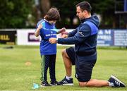 6 July 2022; Ed Fagan, aged 7, with coach Glenn Predy during the 2022 Bank of Ireland Leinster Rugby Inclusion Camp at St Mary's College RFC in Dublin. Photo by Sam Barnes/Sportsfile