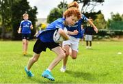 6 July 2022; Jason Drought, aged 11, left, Tim Smyth, aged 12, during the 2022 Bank of Ireland Leinster Rugby Summer Camp at Wanderers FC in Dublin. Photo by Sam Barnes/Sportsfile