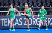 6 July 2022; Hannah Mcloughlin, Elena Tice and Kathryn Mullan  of Ireland warm up before the FIH Women's Hockey World Cup Pool A match between Ireland and Germany at Wagener Stadium in Amstelveen, Netherlands. Photo by Jeroen Meuwse/Sportsfile