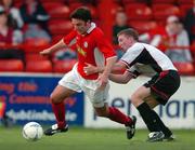 14 May 2004; Stuart Byrne, Shelbourne, in action against Eamon Doherty, Derry City. eircom league, Premier Division, Shelbourne v Derry City, Tolka Park, Dublin. Picture credit; David Maher / SPORTSFILE
