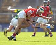 16 May 2004; Niall McCarthy, Cork, in action against James McCarthy, Kerry. Guinness Munster Senior Hurling Championship, Cork v Kerry, Pairc Ui Chaoimh, Cork. Picture credit; Brendan Moran / SPORTSFILE